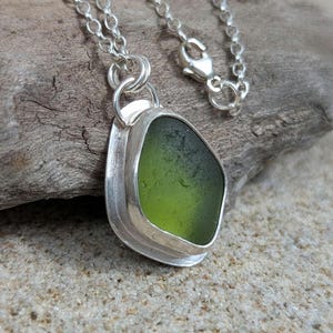 Green sea glass pendant | Hand crafted with recycled sterling silver rimmed setting
