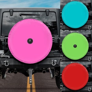 May include: A black Jeep with a spare tire cover. The spare tire cover is available in four colors: pink, turquoise, green, and red.