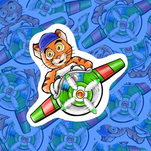 May include: A sticker showing an orange cartoon cat in a blue cap, operating a colourful propeller with green, red, and white details. The background is a repeating pattern of the same image.