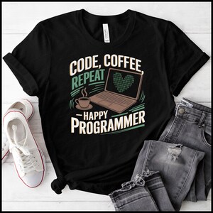May include: Black t-shirt with a green and white design featuring a laptop, a cup of coffee, and the text "Code, Coffee Repeat - Happy Programmer".
