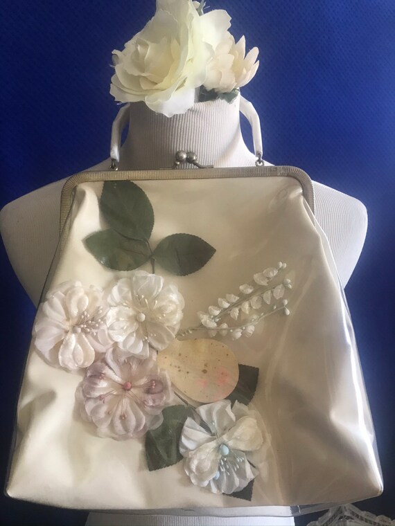 1950s clear vinyl covered handbag with silk flower