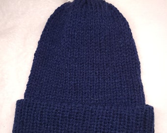 Bonnet bleu marine et blanc à pompons