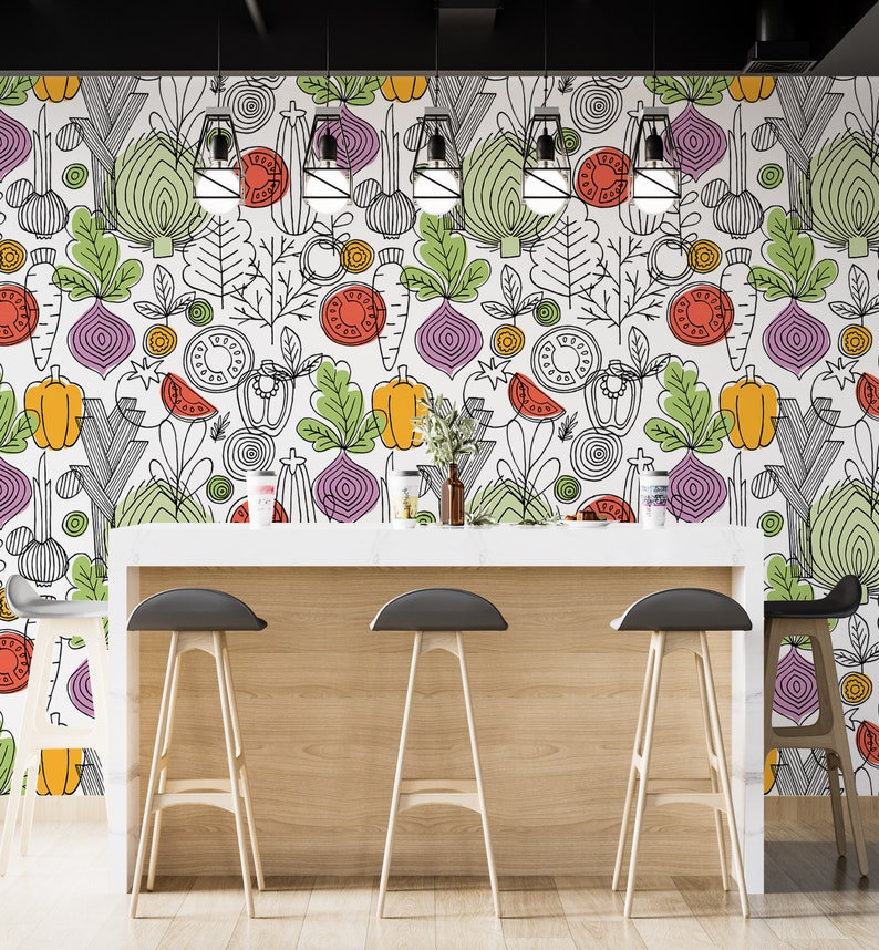 May include: A white kitchen counter with a white countertop and four bar stools. The wall behind the counter is decorated with a colorful wallpaper featuring a repeating pattern of vegetables and herbs.