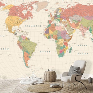 May include: A vintage-style world map wallpaper mural with a cream background and colorful country borders. The map is centered on the Atlantic Ocean and includes the continents of North America, South America, Europe, Africa, Asia, and Australia. The map is surrounded by a grid pattern and includes the names of oceans and continents.