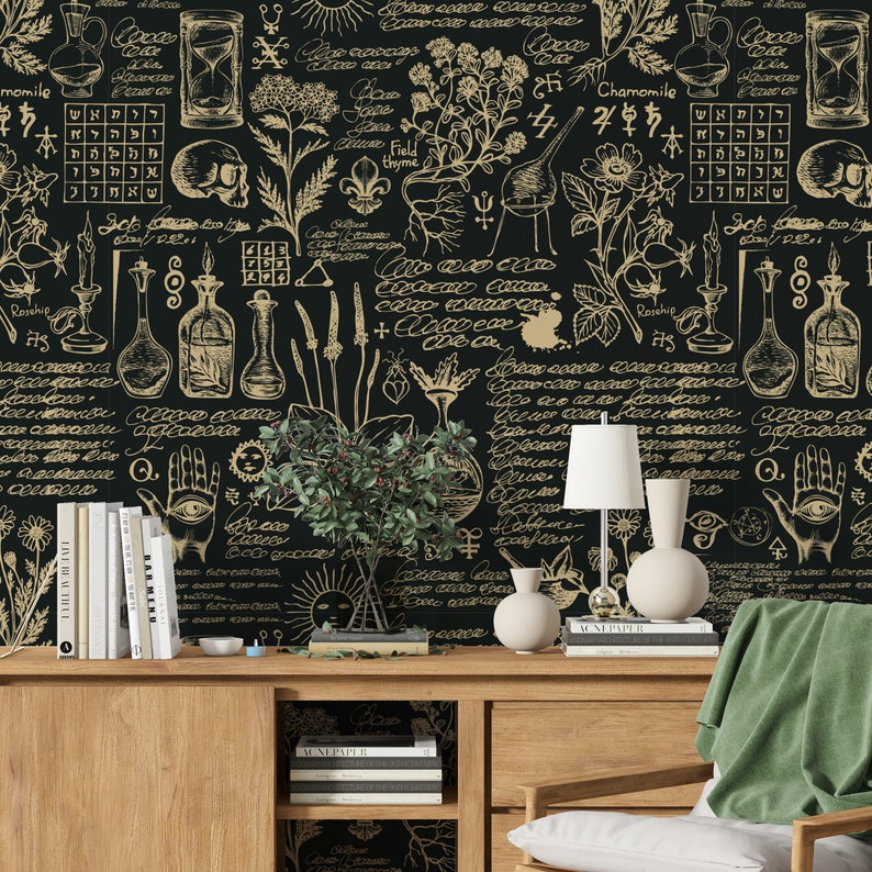 May include: A black and gold wallpaper with a botanical and alchemical theme. The wallpaper features illustrations of plants, herbs, flowers, and other natural elements, as well as symbols and text related to alchemy and witchcraft. The wallpaper is a great way to add a touch of mystery and intrigue to any room.