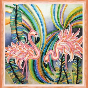 May include: A framed artwork featuring two pink flamingos, embellished with beads, set against a backdrop of colorful, beaded arcs and stylized foliage. The artwork is framed in a warm, light brown wooden frame.