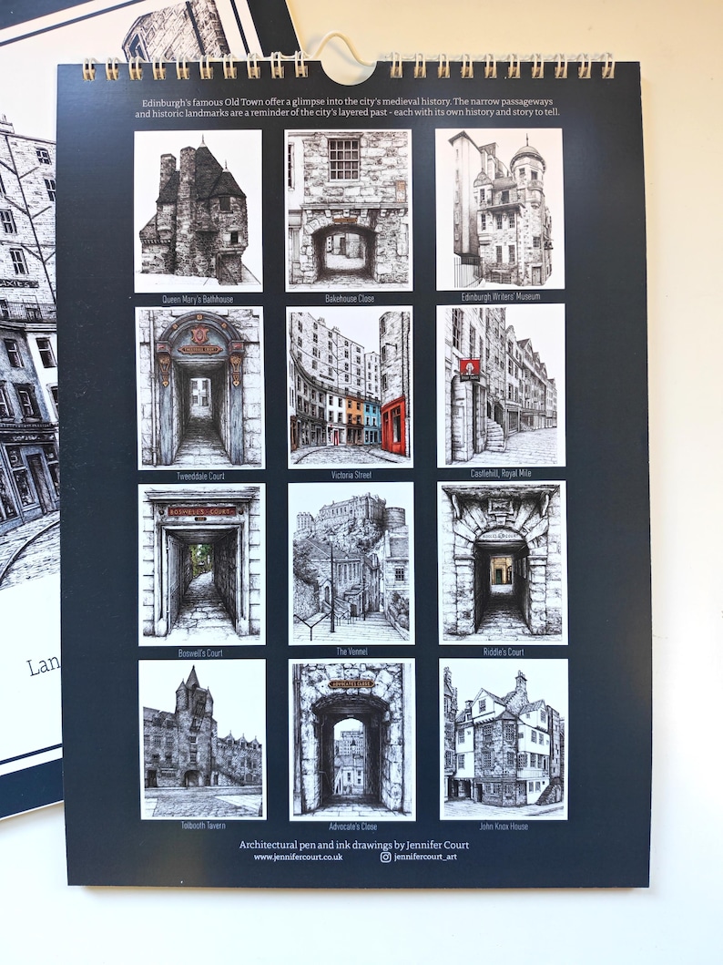 May include: A wall calendar featuring twelve black and white pen and ink architectural drawings of Edinburgh landmarks. Each square illustration is labeled with the location name, including Queen Mary's Bathhouse, Victoria Street, and John Knox House.