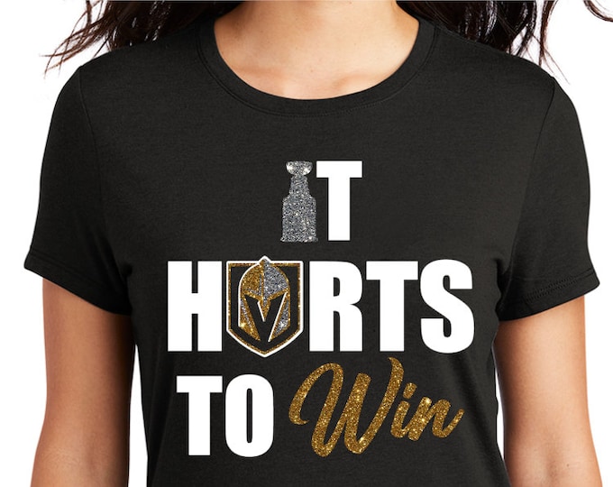 It Hurts To Win Knights flat white and glitter accent decal on black shirt