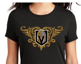 Gold winged heart VGK hockey glitter decal on black shirt