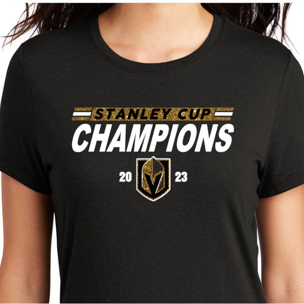 Stanley Cup Champions 2023 on black top with white flat vinyl and either gold glitter or metallic vinyl accents