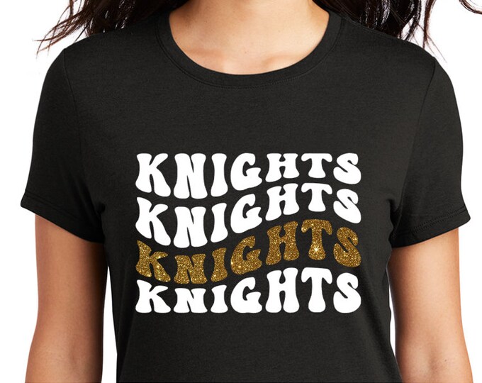 Wavy Knights in white screen with gold glitter accent decal on black shirt