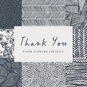 May include: A collage of black and white patterns with a white rectangle in the center that says "Thank You Paper Flowers Creative".
