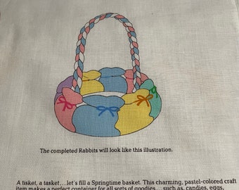 May include: A pastel-colored craft basket made of soft-sculpture bunnies, with a braided handle. The basket is 12 inches high and 10 inches wide. It is a perfect container for small gifts, candies, or other goodies.