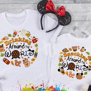 May include: Two white t-shirts with a circle design featuring a cartoon image of the Epcot World Showcase Lagoon and the text "Drinking Around the World" and "Snacking Around the World". The shirts are surrounded by Mickey Mouse ears, a Minnie Mouse plush toy, and a Mickey Mouse plush toy.