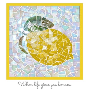 May include: A mosaic artwork of a yellow lemon with green leaves. The background is made of small, iridescent tiles. The text "When life gives you lemons" is written below the image.