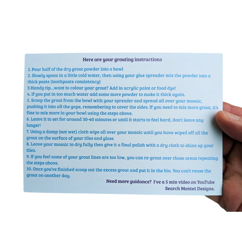 May include: A white card with blue text outlining instructions for grouting a mosaic. The card includes a handy tip for adding color to the grout and a suggestion to watch a 5-minute video on YouTube for more guidance.