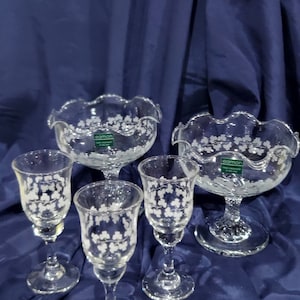 May include: Set of five clear glass serving dishes with a white shamrock design. The dishes are made by Eamon, Ireland.