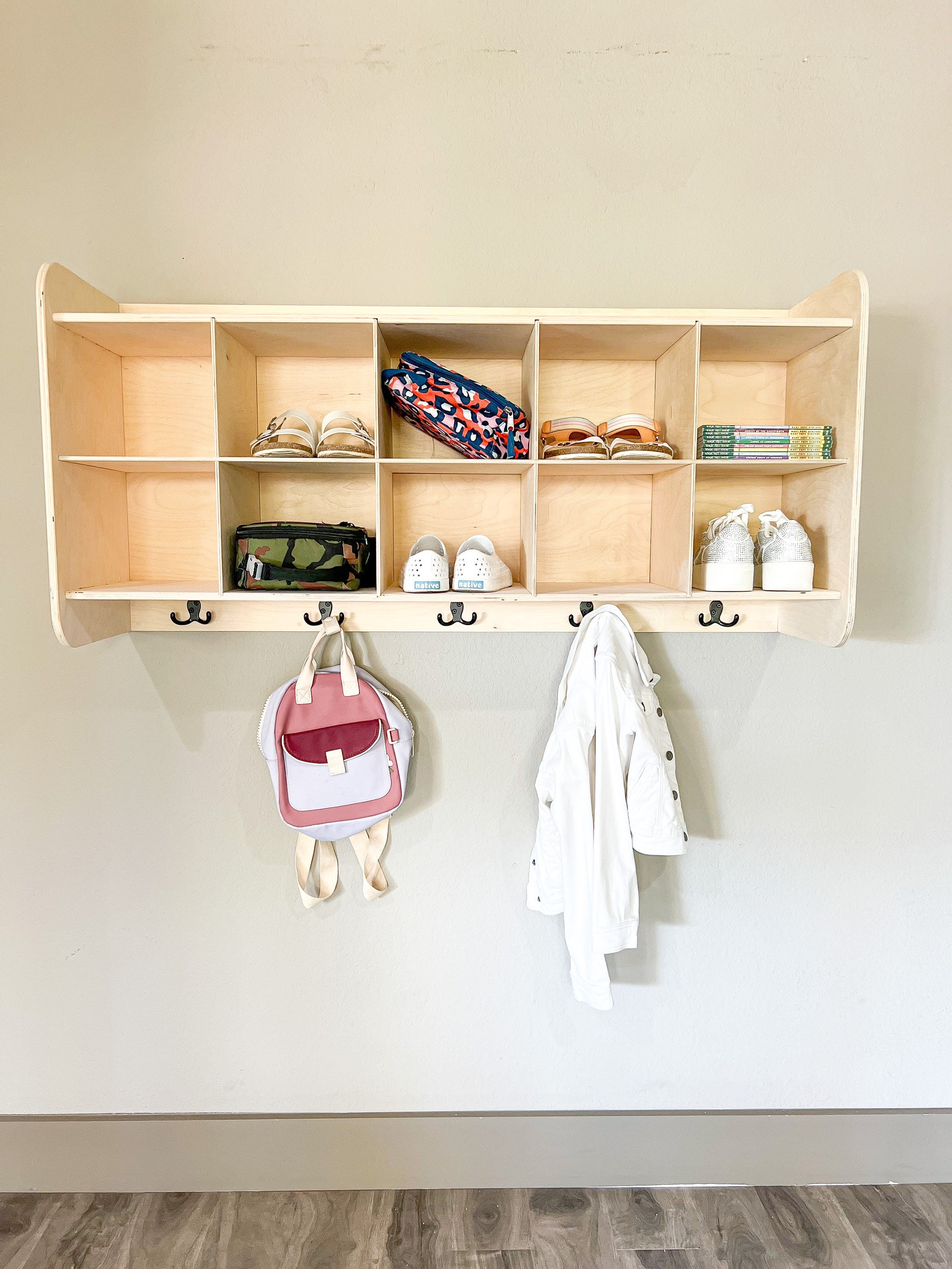 By removing the hanger rod and adding a cube storage bench, hooks and a  shelf, this tiny closet …