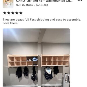 May include: Two wall-mounted cubby units with multiple compartments. The units are made of light-colored wood and are mounted on a gray wall. Coats and jackets hang below the units. The text "CARLY- 28" and 46"- Wall Mounted Cu..." is visible.