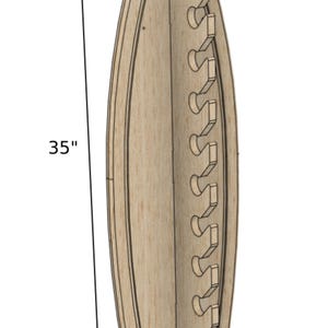 May include: A wooden wall-mounted rod holder with a curved shape. It has 10 slots for rods and measures 35 inches tall, 9 inches wide, and 4.5 inches deep.