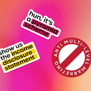 May include: Three stickers with text on a pink and orange gradient background. The first sticker is yellow with black text that reads "show us the income disclosure statement". The second sticker is white with black text that reads "hun, it's a pyramid scheme". The third sticker is red with white text that reads "ANTI MULTI-LEVEL MARKETING" with a red diagonal line through the circle.