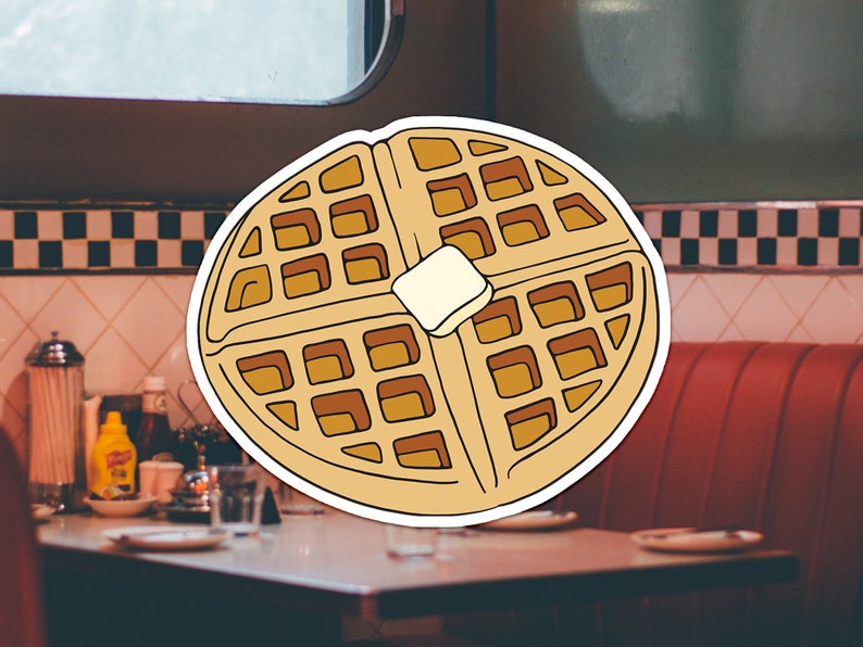May include: A cartoon illustration of a waffle with a pat of butter on top. The waffle is brown and yellow and has a white outline. The background is a blurry image of a diner.