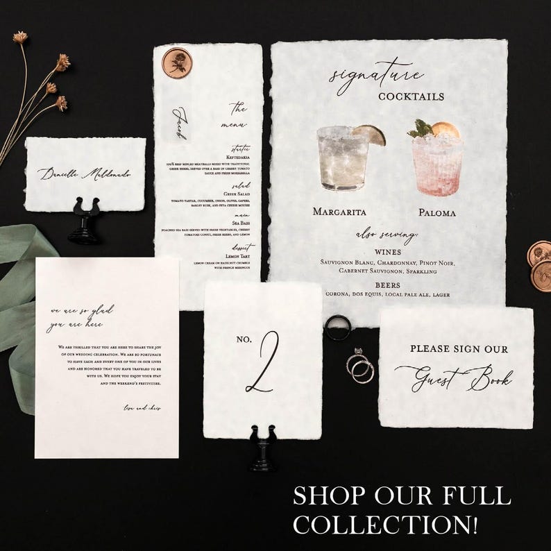 May include: A wedding stationery set with a rustic, vintage aesthetic. The stationery includes a table number card, a sign for guests to sign, and a menu card. The cards are printed on textured paper with a distressed look. The table number card is a simple design with the number "2" written in black ink. The sign for guests to sign is a simple design with the words "Please sign our Guest Book" written in black ink. The menu card is a more elaborate design with a list of cocktails, wines, and beers. The cocktails are illustrated with watercolour paintings of margaritas and palomas. The menu card also includes the text "Signature Cocktails" and "Also Serving".