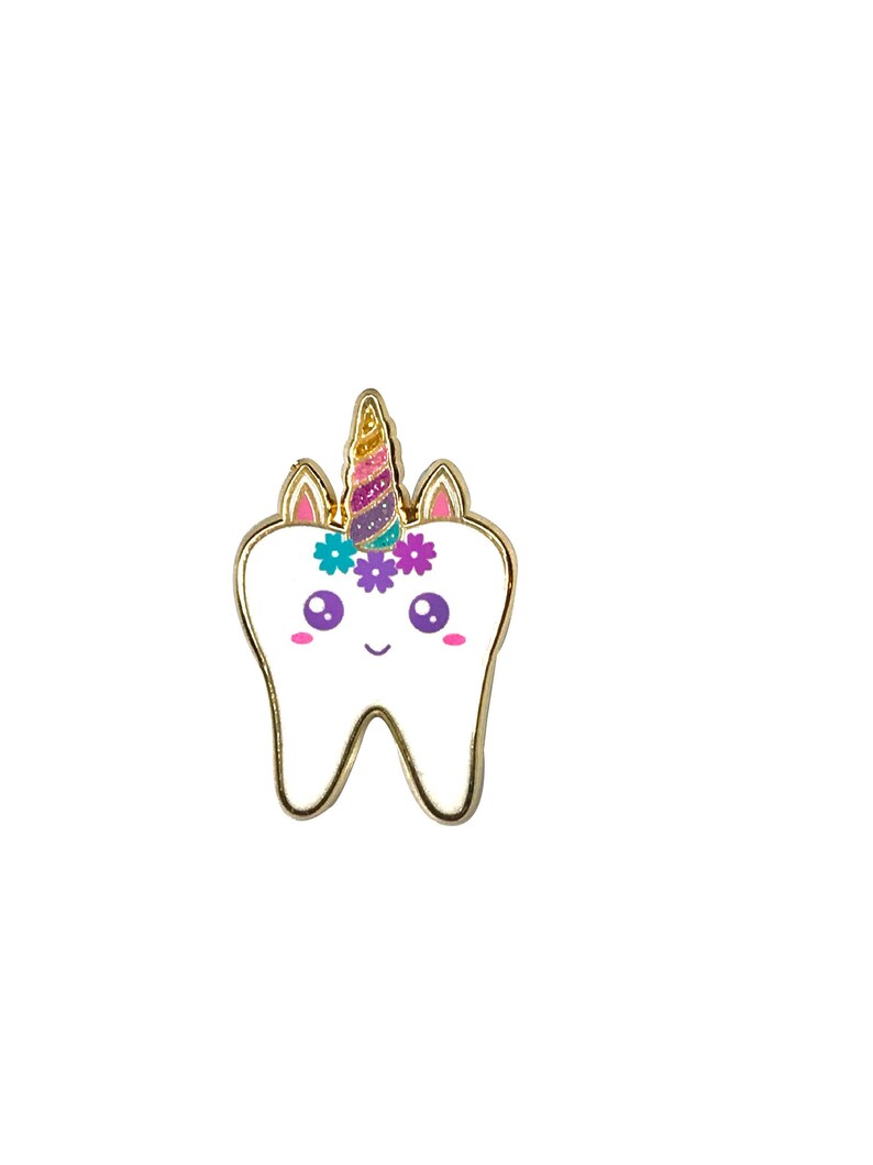 May include: A white tooth with a gold outline and a unicorn horn with pink, purple, and blue glitter. The tooth has pink cheeks and purple eyes. There are three purple flowers with yellow centers on the tooth.