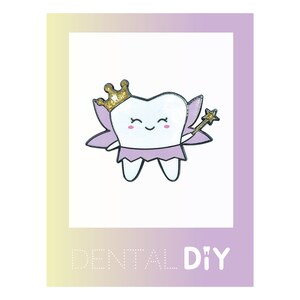 May include: A white tooth with a pink fairy costume, a gold crown, and a gold star wand. The tooth is smiling and has pink cheeks. The image is framed with a purple and yellow gradient background and the text "DENTAL DIY".