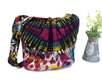 May include: A colourful tie-dye fabric tote bag with a black background and a wooden button closure. The bag has a long strap and is made of a soft, lightweight fabric.