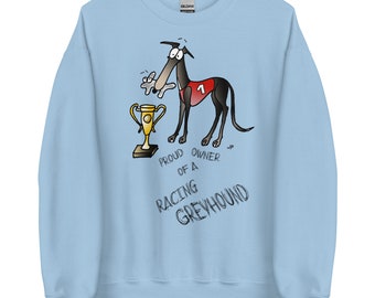 May include: Light blue sweatshirt with a cartoon illustration of a greyhound dog wearing a red racing bib and holding a trophy. The text "Proud owner of a racing greyhound" is printed below the illustration.
