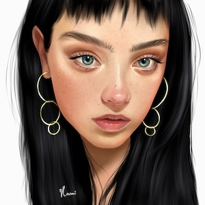 May include: A portrait of a person with long black hair and bangs. They are wearing gold hoop earrings. The person has freckles and blue eyes.