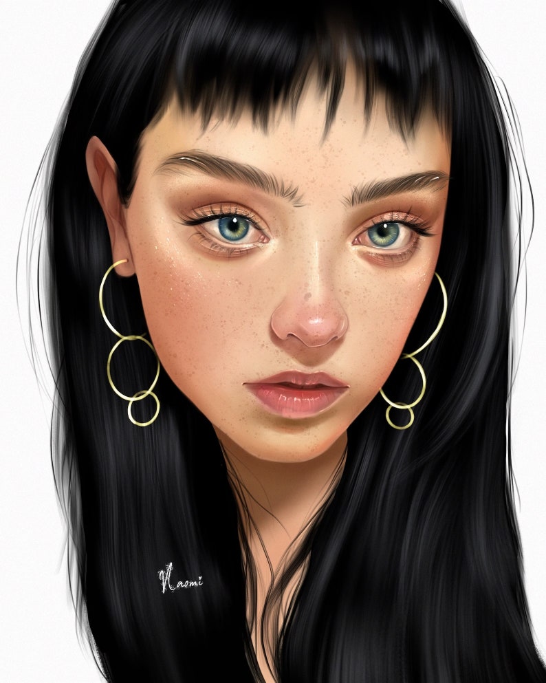 May include: A portrait of a person with long black hair and bangs. They are wearing gold hoop earrings. The person has freckles and blue eyes.