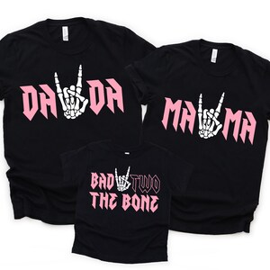 Cute 2nd birthday shirt for rock and roll theme party.
Toddler girl second birthday skeleton graphic shirt.
Bad Two the Bone rock n roll birthday shirt for toddler.