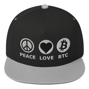May include: A black and gray baseball cap with a flat brim. The cap features embroidered symbols of peace, a heart, and the Bitcoin logo, with the words "PEACE LOVE BTC" below. The top button is gray.