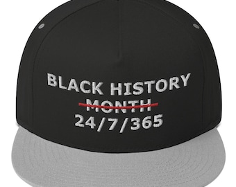 May include: Black flat brimmed baseball cap with a gray brim. The front of the cap has white embroidery that reads "BLACK HISTORY MONTH" with a red line through "MONTH" and "24/7/365" below.