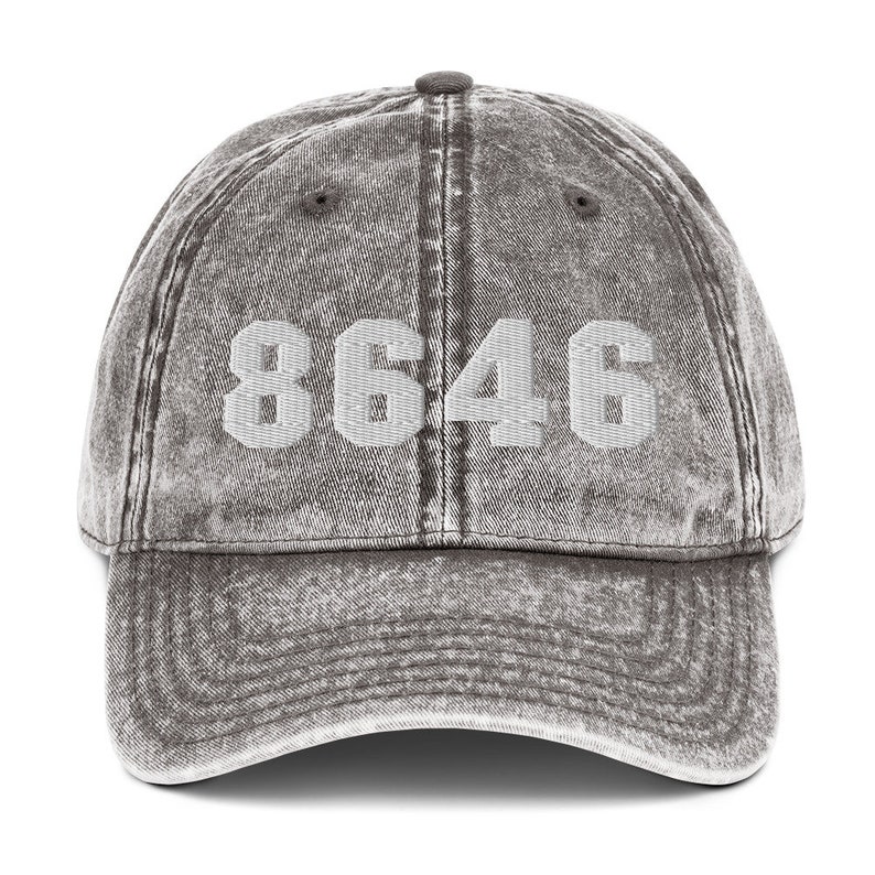 May include: A gray vintage-style baseball cap with the number "8646" embroidered in white on the front.