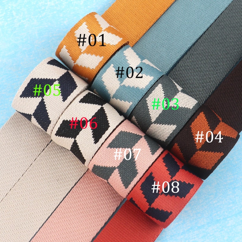 May include: Eight different fabric ribbon trims with geometric patterns. The trims are in various colors, including black, white, orange, brown, gray, blue, and pink. The trims are labeled with numbers 01 through 08.