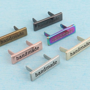 Etichetta per borsa/borsa, 36x10 mm, oro rosa/argento/nero pistola/oro chiaro/metallo arcobaleno, etichette rettangolari "fatte a mano" con piedini per prodotti artigianali personalizzati
