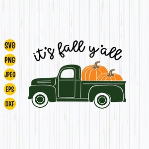 Könnte beinhalten: Ein grüner Vintage-Pickup mit zwei orangefarbenen Kürbissen in der Ladefläche. Der Text "it's fall y'all" steht über dem LKW.