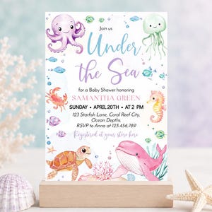 May include: A rectangular baby shower invitation card featuring watercolor illustrations of an octopus, jellyfish, crab, seahorse, turtle, and whale. The text reads: Join us Under the Sea for a Baby Shower honoring SAMANTHA GREEN SUNDAY APRIL 20TH AT 2 PM.