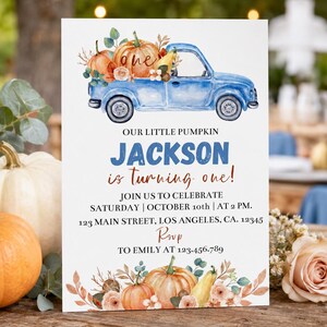 May include: A rectangular invitation card featuring a watercolor blue truck carrying pumpkins. Text reads: OUR LITTLE PUMPKIN JACKSON is turning one! JOIN US TO CELEBRATE SATURDAY | OCTOBER 10th | AT 2 PM. 123 MAIN STREET, LOS ANGELES, CA. 12345 RSVP TO EMILY AT 123.456.789.