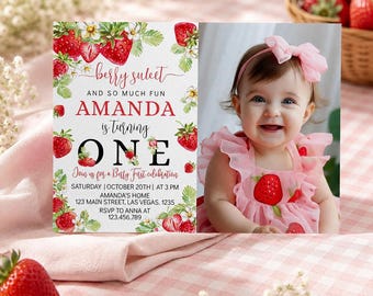 May include: A first birthday invitation card featuring strawberry illustrations and the text Berry Sweet and so much fun Amanda is turning one, alongside a photograph of a baby wearing a pink ruffled dress with a matching pink hair bow.