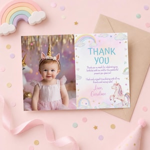 May include: A rectangular thank you card featuring a photograph of a child wearing a gold unicorn horn headband and a light pink dress. The card includes the text THANK YOU, a message about a birthday, the name Caroline, and unicorn graphics.