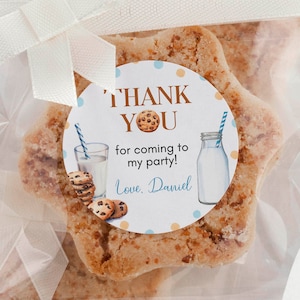 May include: Star-shaped cookies in clear cellophane bags, tied with white ribbons. Each cookie has a round sticker with the text "THANK YOU" and a milk and cookie graphic. The cookies are for a party.