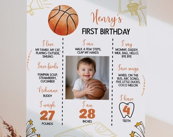 May include: A basketball-themed first birthday milestone poster with a photo of a baby boy. The poster features the baby's name, Henry, and details about his first year, including his weight, height, favorite foods, and songs. The poster is decorated with basketballs, stars, and other sports-themed graphics.