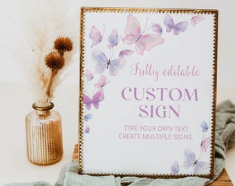 May include: A white sign with a gold frame and purple butterflies. The sign says "Fully editable CUSTOM SIGN TYPE YOUR OWN TEXT CREATE MULTIPLE SIGNS."