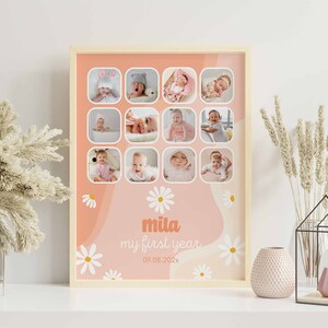 May include: A framed collage featuring twelve baby photos in a light wood frame. The background is peach and white with daisy accents. The text "mila my first year 09.08.202x" is displayed in the lower center.