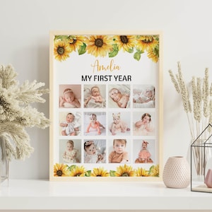 Może przedstawiać: Oprawiony kolaż zdjęć z dwunastoma zdjęciami dziecka, z napisem "Amelia MY FIRST YEAR". Rama jest ozdobiona ż&oacute;łtymi słonecznikami. Kolaż jest wyświetlany na białej powierzchni z elementami dekoracyjnymi.