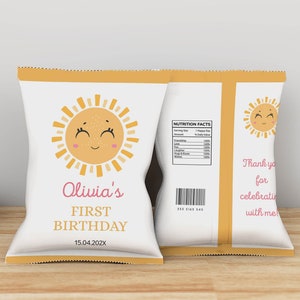May include: A white chip bag with a yellow border and a smiling sun illustration. The bag says "Olivia's First Birthday 15.04.202X".
